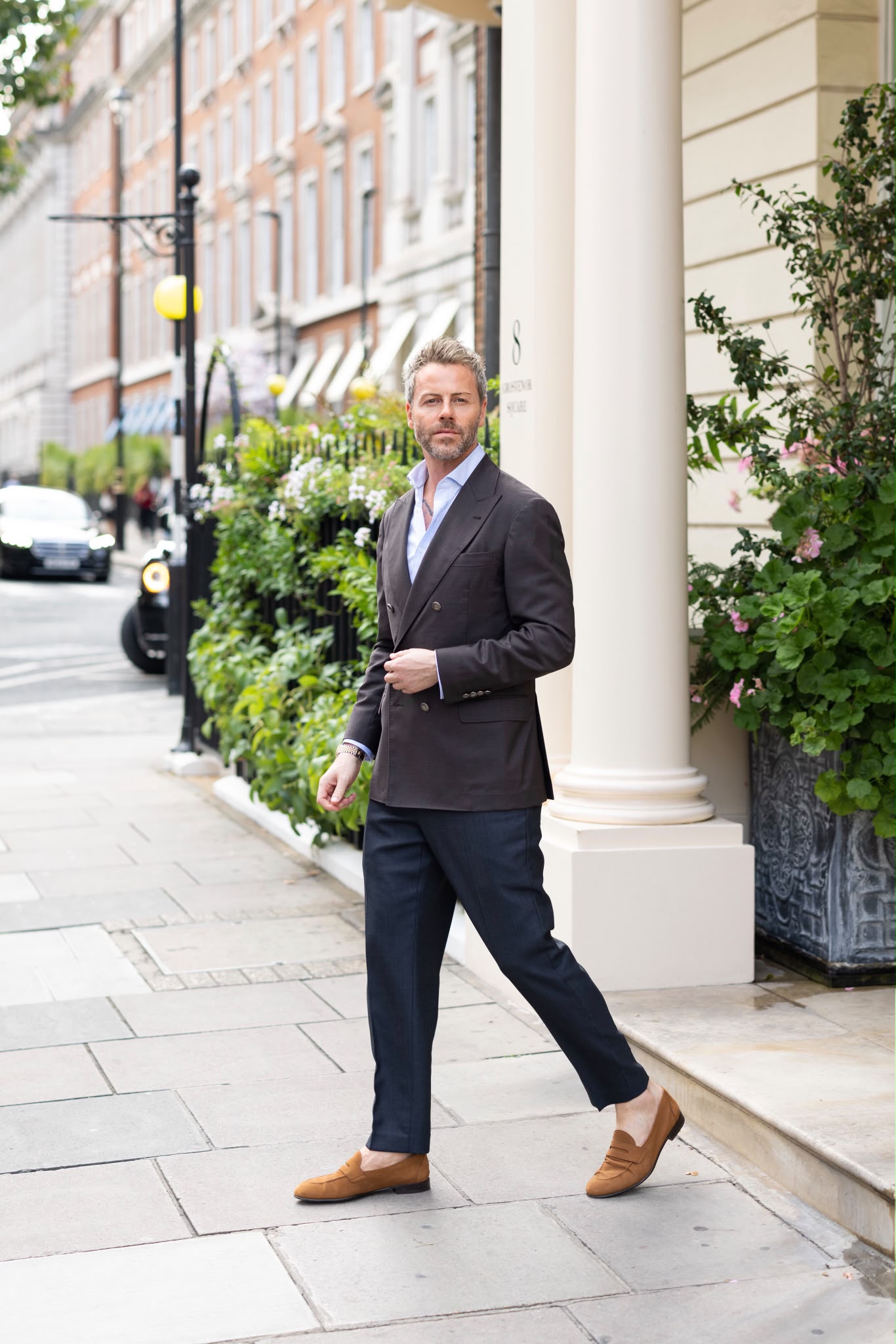 Gilberto Ramerini in a double-breasted blazer, walking along a London street