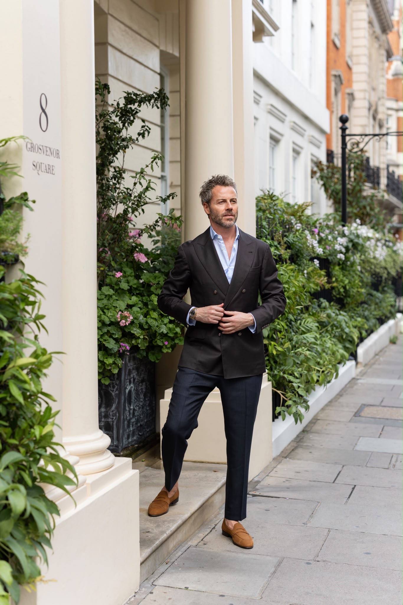 Gilberto Ramerini in a double-breasted blazer at a Grosvenor Square doorway