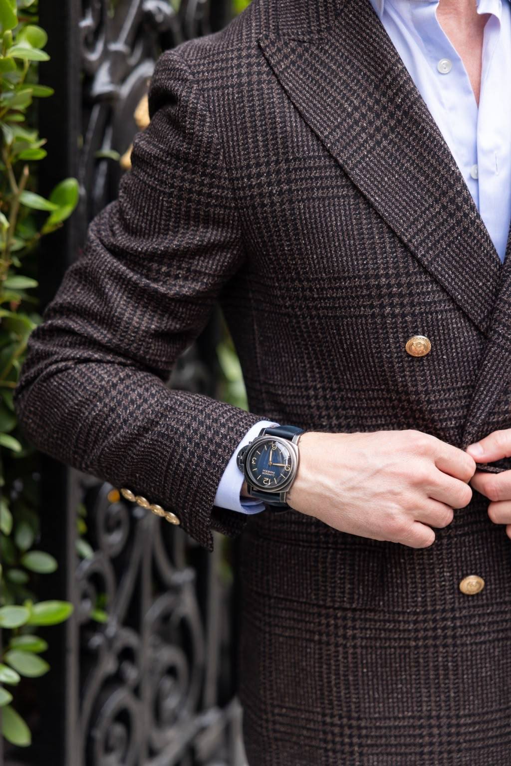 Gilberto Ramerini in a plaid blazer, with a watch at the cuff